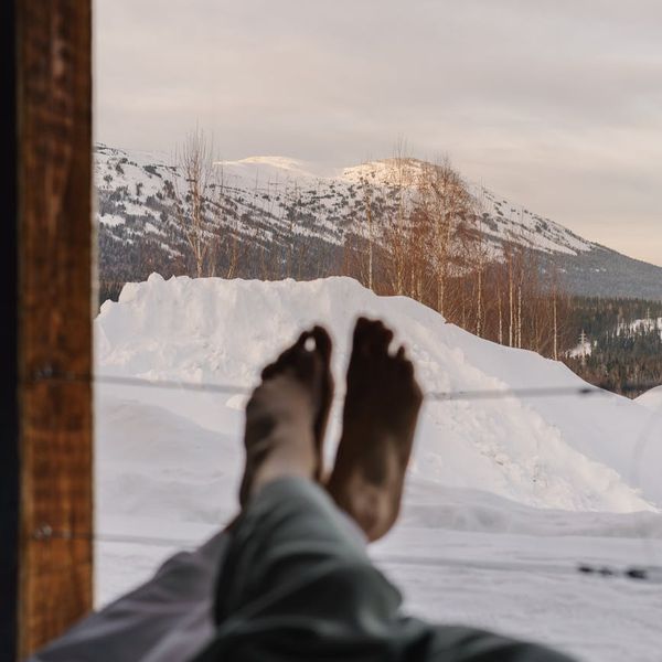 Person meditating outdoors feeling balanced and calm.
